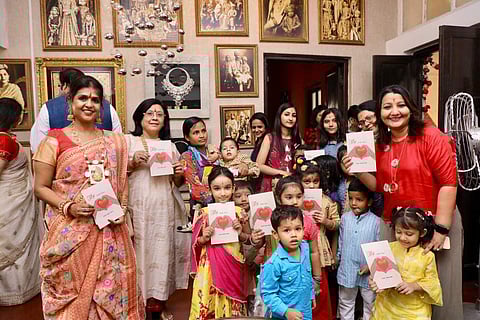 Alka Dalmia and Sangeeta Thacker with the children of wings at the grand opening of pre-owned multi-designer boutique Dil Se
