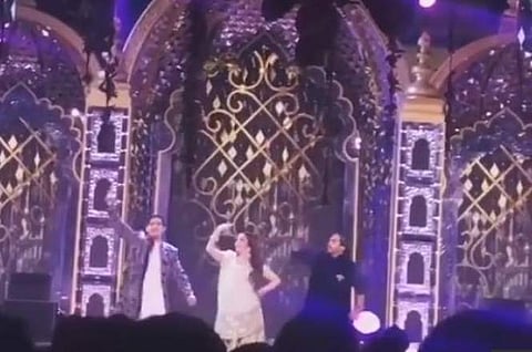 Nita Ambani perform with sons Akash and Anant
