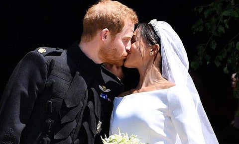 Prince Harry and Meghan Markle share a kiss after their wedding at St George's Chapel in the Windsor Castle.