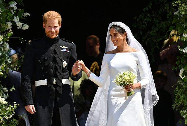 Prince Harry and Meghan Markle walk out of the chapel after taking their vows at the altar at the Royal Wedding