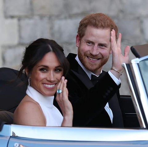 Meghan Markle and Prince Harry enroute their wedding reception.