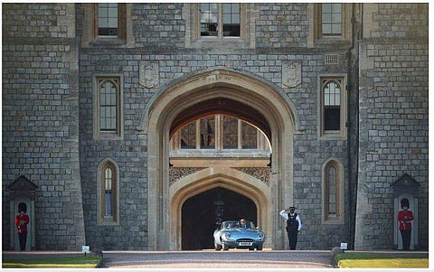 Prince Harry and Meghan Markle depart from Windsor Castle.