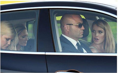 Lady Kitty Spencer and her sister Lady Eliza, cousin of Prince Harry arrive for the reception with their mother Victoria Aitken.
