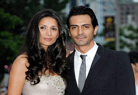 Arjun Rampal and Mehr Jessia at an event