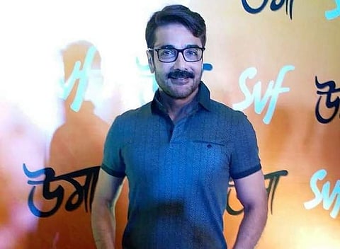 Reigning star of Tollywood Prosenjit Chatterjee looking dapper in blue denims at the special screening of Uma.