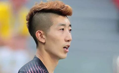 South Korean keeper Cho Hyun-woo sports a fluffy coloured mohawk.