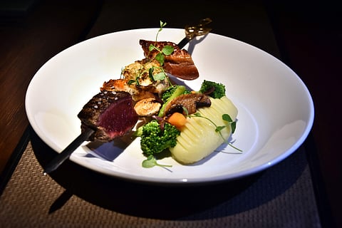 Grilled jumbo prawns, pan-roasted chicken & lamb bourguignon