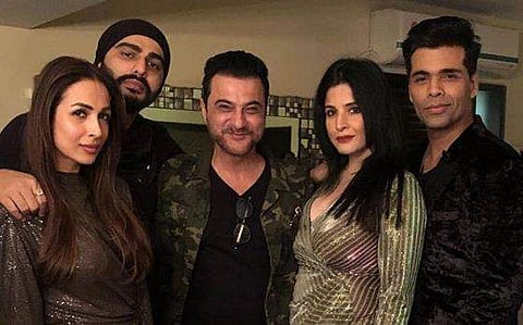 Arjun Kapoor and Malaika Arora with Sanjay and Maheep Kapoor, with Karan Johar