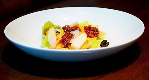 A plate of Xato with Romesco sauce