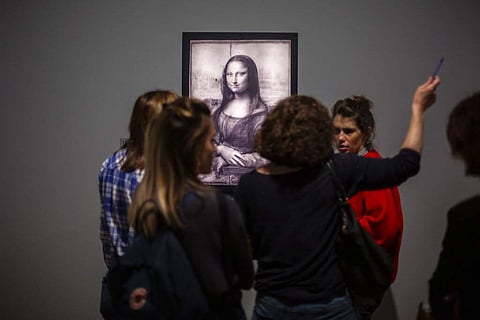 At the Louvre museum (AP Photo/Rafael Yaghobzadeh)
