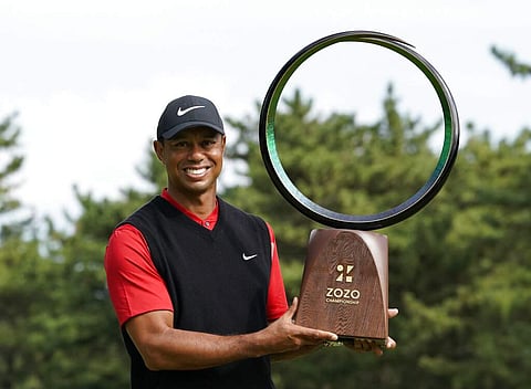 Tiger Woods poses with his trophy after winning the Zozo Championship PGA Tour at the Accordia Golf Narashino country club in Inzai, Japan. (AP Photo/Lee Jin-man)