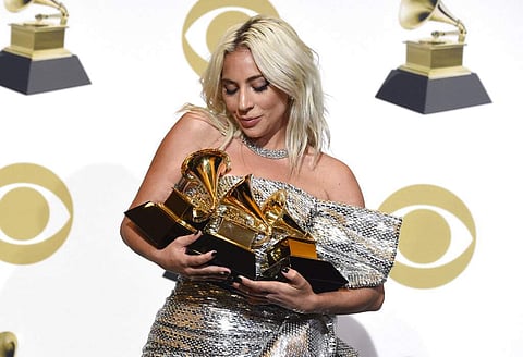 Lady Gaga in the press room with her awards at the 61st annual Grammy Awards (Photo by Chris Pizzello/Invision/AP, File)