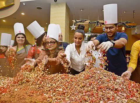 Stars of Aparna Sen directed Ghawre Bairey Aaj mix the ingredients at the cake mixing ceremony