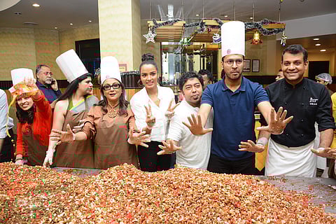 At Flurys the cast of Ghawre Bairey Aaj including Aparna Sen, Tuhina Das and Anirban Bhattacharya participated in the cake-mixing ceremony