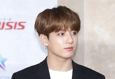 A member of K-pop group BTS, Jungkook, poses for the media at the Asia Artist Awards (Cho Su-jeung/Newsis via AP)