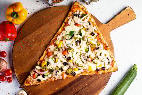 A slice of pizza that's served at Red Tomato