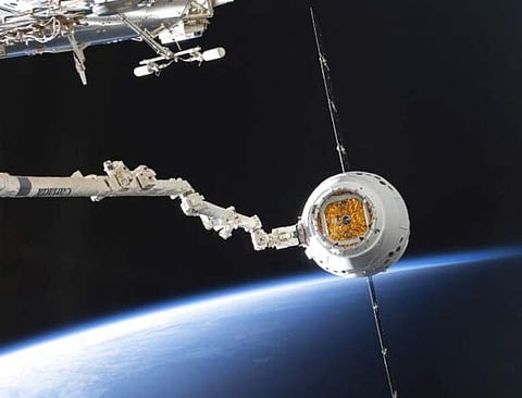 SpaceX Dragon capsule at the ISS (NASA via AP)