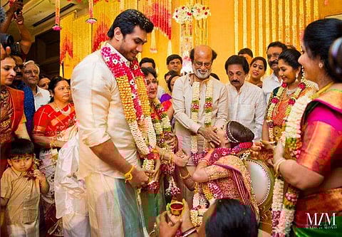 Vishagan puts the garland around Soundarya's neck at their ceremony in Chennai on Monday.