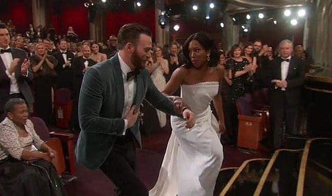 Chris Evans helps Regina King