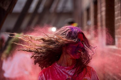 Kathmandu, March 20, 2019 (Xinhua) - A girl plays with coloured powder during Holi at the premises of Basantapur Durbar Square in Kathmandu, Nepal. (Xinhua/Sulav Shrestha/IANS)