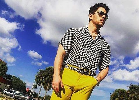 Nick Jonas teased fans with the Instagram post saying he is busy shooting something
