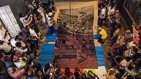 Pangrok Sulap unveiling their work at Anand Warehouse, Fort Kochi. All images courtesy Kochi Biennale Foundation.