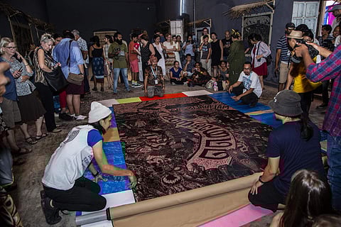 Pangrok Sulap unveiling their work at Anand Warehouse, Fort Kochi. All images courtesy Kochi Biennale Foundation.