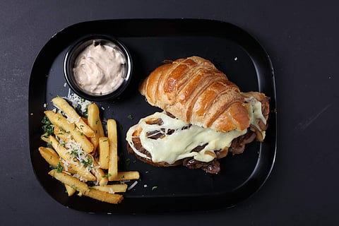 A croissant sandwich from the menu