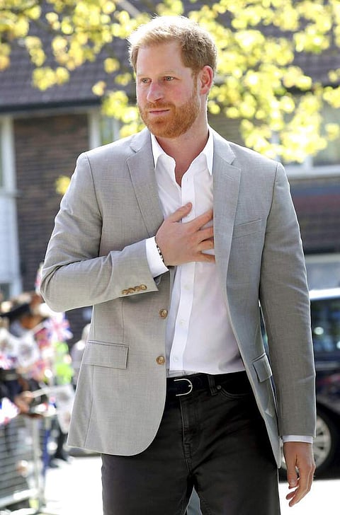Wellwishers welcome Britain's Prince Harry as he arrives for the official opening of 'Future', a new Youth Zone in London, Thursday April 11, 2019. (Chris Jackson/PA via AP)