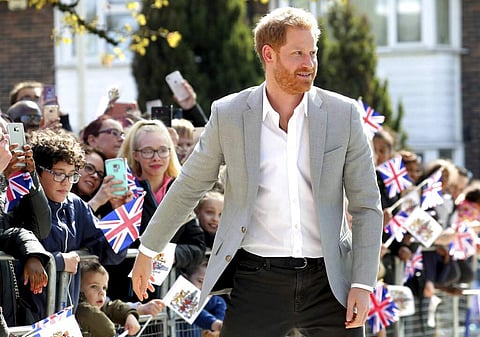 Wellwishers welcome Britain's Prince Harry as he arrives for the official opening of 'Future', a new Youth Zone in London, Thursday April 11, 2019. (Chris Jackson/PA via AP)