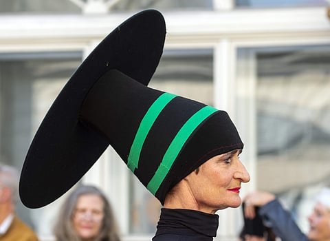 A woman dressed in a costume performs during the so-called Bauhaus Parade to celebrate the 100th anniversary of the Bauhaus movement in Weimar, Germany. (AP Photo/Jens Meyer)
