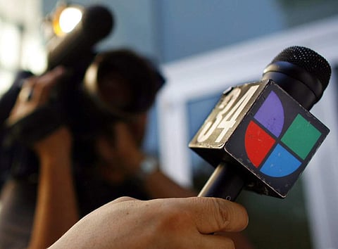 File photo: Univision logo in Los Angeles. (AP Photo/Damian Dovarganes)