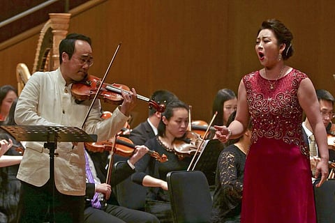 South Korean violinist Won Hyung Joon and his North Korean soprano partner Kim Song Mi perform at the Shanghai Oriental Arts Center in Shanghai on Sunday, May 12, 2019. (AP Photo/Dake Kang)