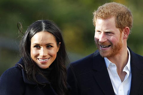Dec 1, 2017 file photo: Prince Harry and his fiancee Meghan Markle arrive at Nottingham Academy in Nottingham, England. (AP Photo/Frank Augstein)