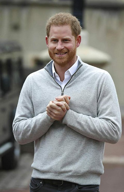 Prince Harry speaks at Windsor Castle after his wife Meghan, the Duchess of Sussex gave birth to a baby boy. This is their first child, after they got married a year ago. (Steve Parsons/Pool via AP)