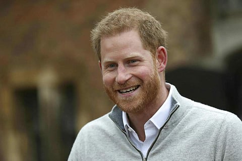 Prince Harry speaks at Windsor Castle after his wife Meghan, the Duchess of Sussex gave birth to a baby boy. This is their first child, after they got married a year ago. (Steve Parsons/Pool via AP)
