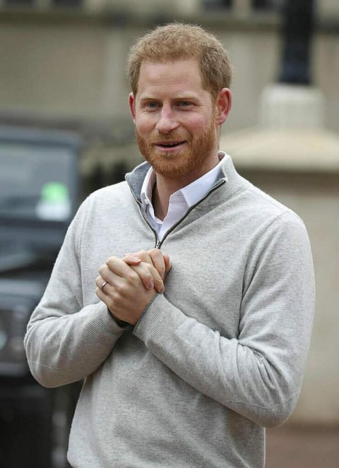 Prince Harry speaks at Windsor Castle after his wife Meghan, the Duchess of Sussex gave birth to a baby boy. This is their first child, after they got married a year ago. (Steve Parsons/Pool via AP)