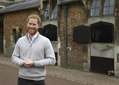 Prince Harry speaks at Windsor Castle after his wife Meghan, the Duchess of Sussex gave birth to a baby boy. This is their first child, after they got married a year ago. (Steve Parsons/Pool via AP)