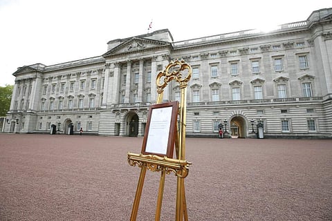 A notice placed on an easel in the forecourt of Buckingham Palace formally announces the birth of a baby boy to Britain's Prince Harry and Meghan, the Duchess of Sussex. (Yui Mok/Pool Photo via AP)