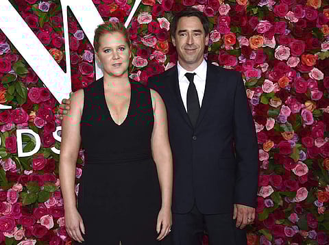 2018 file photo of Amy Schumer & Chris Fischer in New York (Photo by Evan Agostini/Invision/AP)