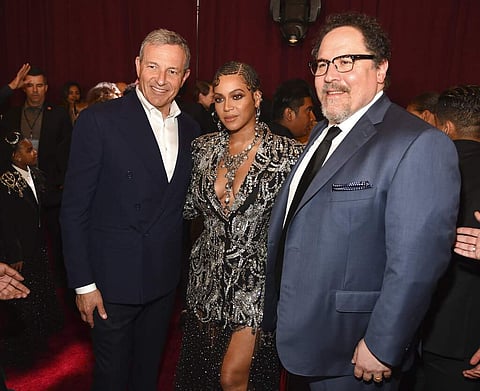 Bob Iger, chairman & CEO of The Walt Disney Company with The Lion King cast member Beyonce and director Jon Favreau at the premiere at El Capitan Theatre, LA. (Photo by Chris Pizzello/Invision/AP)