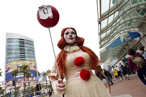 Ana Niebla of San Diego models her own Princess Pennywise outfit before Preview Night of the 2019 Comic-Con International: San Diego. (Photo by Chris Pizzello/Invision/AP)