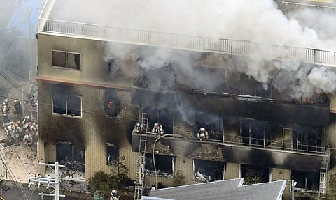Firefighters trying to put out the fire at the studio