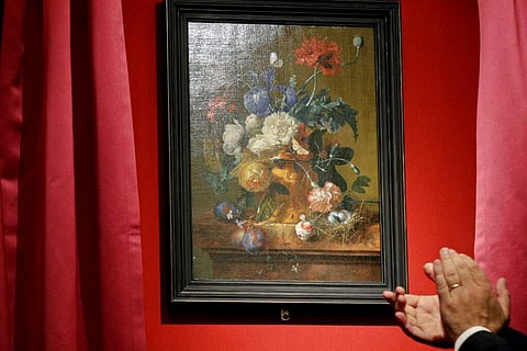 Unveiling of 'Vase of Flowers' by Jan van Huysum, at the Pitti Palace, Uffizi Galleries, in Florence, Italy. Germany returned the Dutch painting after it was stolen in WWII. (AP Photo/Gregorio Borgia)