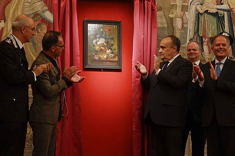 Unveiling of 'Vase of Flowers' by Jan van Huysum, at the Pitti Palace, Uffizi Galleries, in Florence, Italy. Germany returned the Dutch painting after it was stolen in WWII. (AP Photo/Gregorio Borgia)
