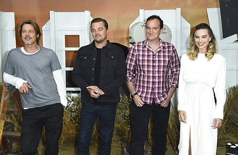Brad Pitt, Leonardo DiCaprio, Quentin Tarantino and Margot Robbie (Photo by Jordan Strauss/Invision/AP)
