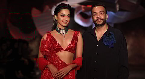 Kiara Advani (wearing an ensemble from the collection) and Amit Aggarwal