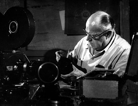 Josef Wirsching servicing his camera equipment at the Bombay Talkies studios, early-1950s