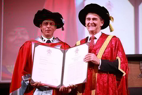 Shah Rukh Khan poses with his doctorate degree