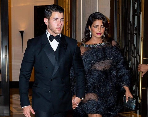 Joe Jonas marked his 30th birthday with a Bond-themed party. Priyanka Chopra and husband Nick Jonas were spotted walking hand-in-hand as they attended the party. (Photo: IANS)